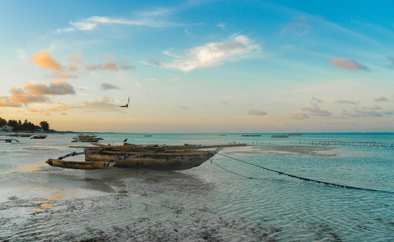 Wooden dhow on a Zanzibar beach at golden hour